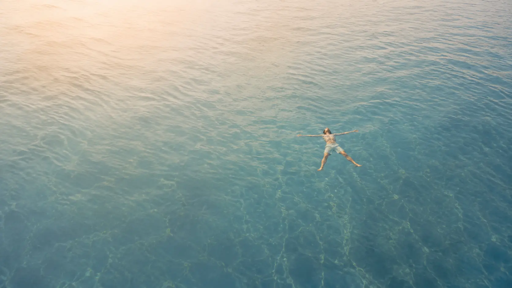 Trevor floating peacefully in open water, welcoming reflection and connection across different chapters